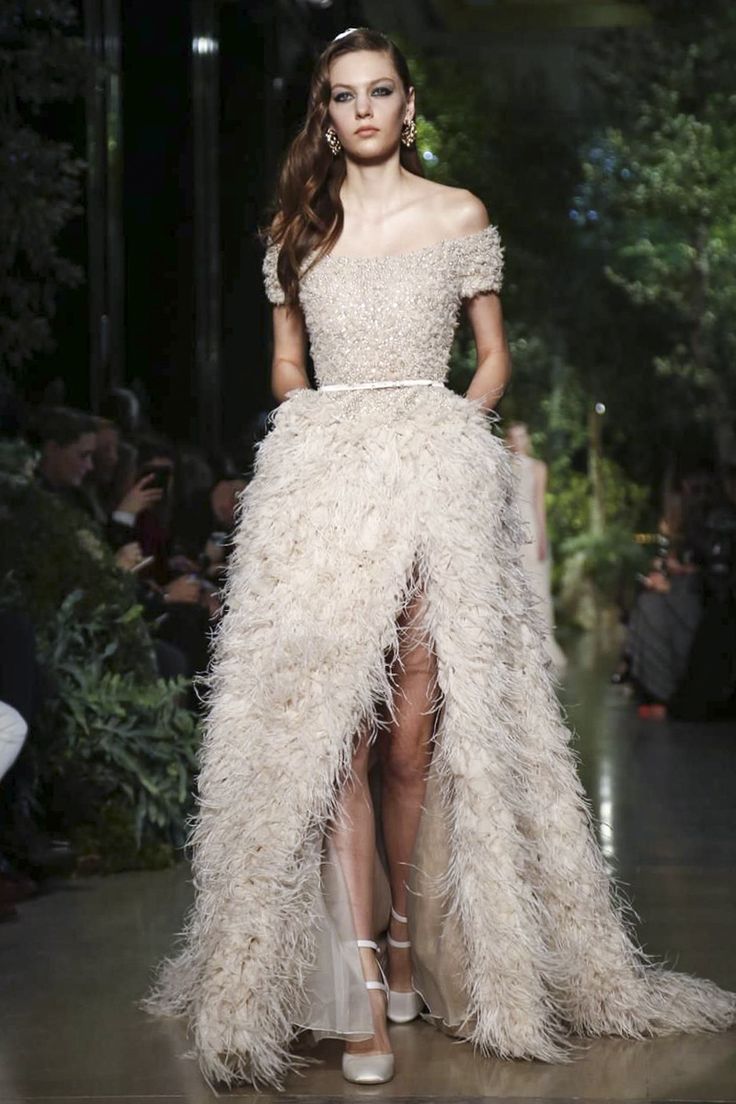 A wedding dress with feathers