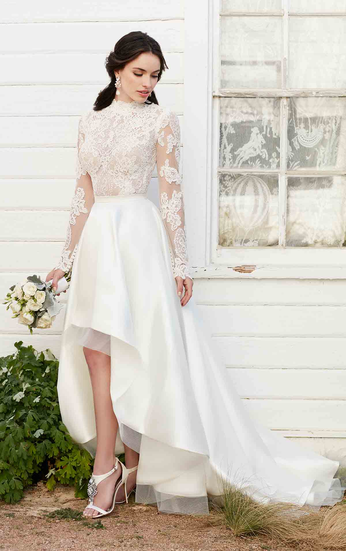 A high low wedding gown with long sleeves