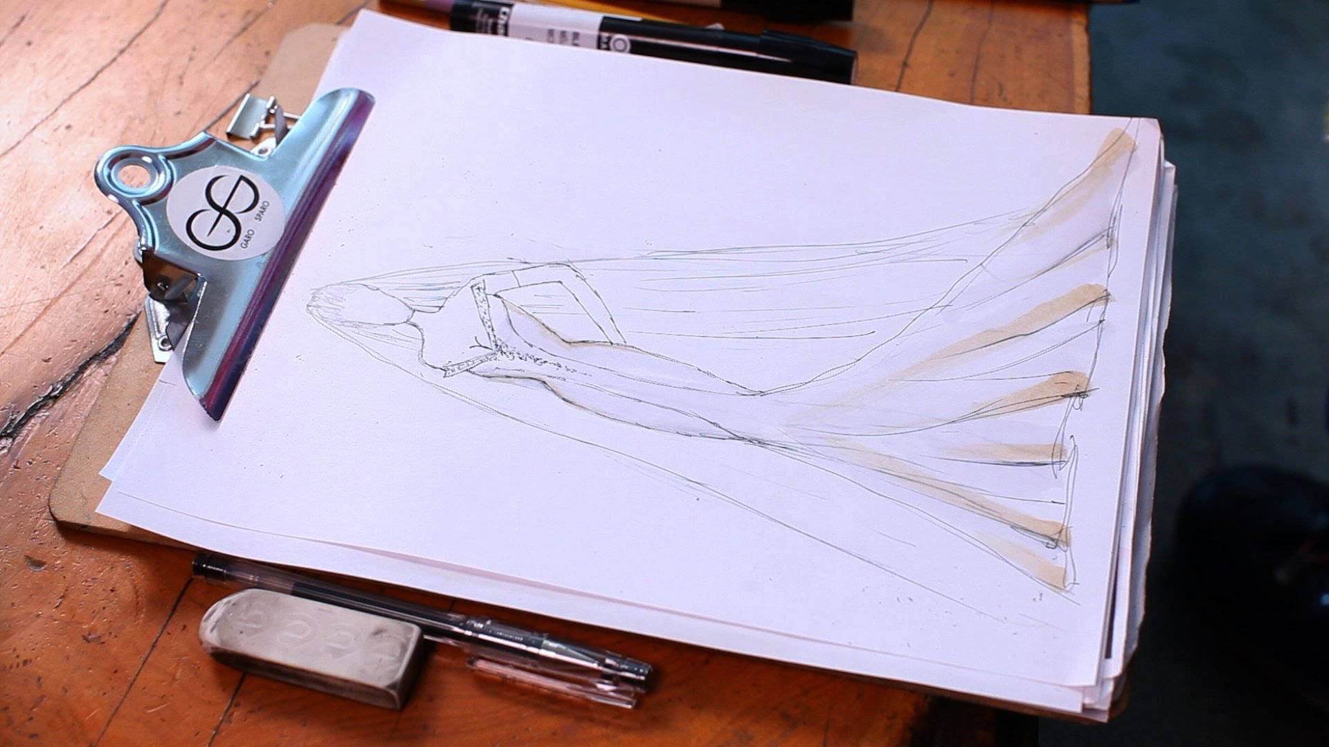 Drawing the sketch of the wedding gown
