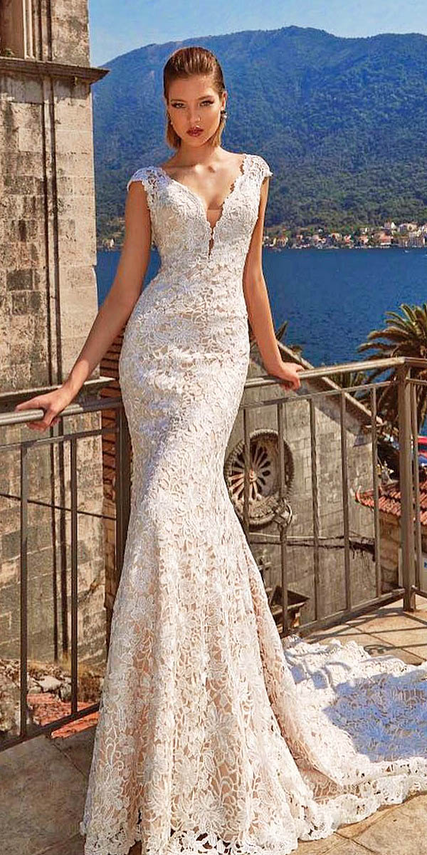 V-neck lace wedding dress with cap sleeves