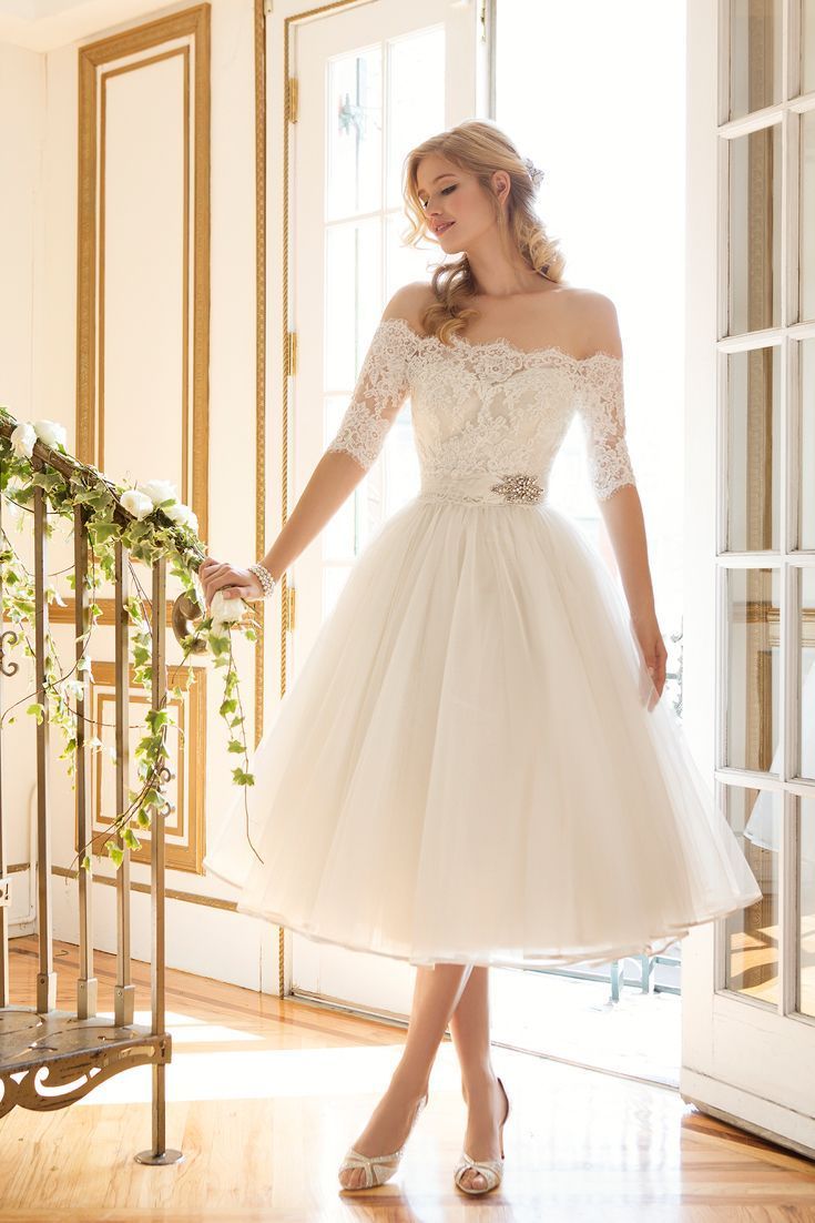 An off-shoulder tea length wedding dress