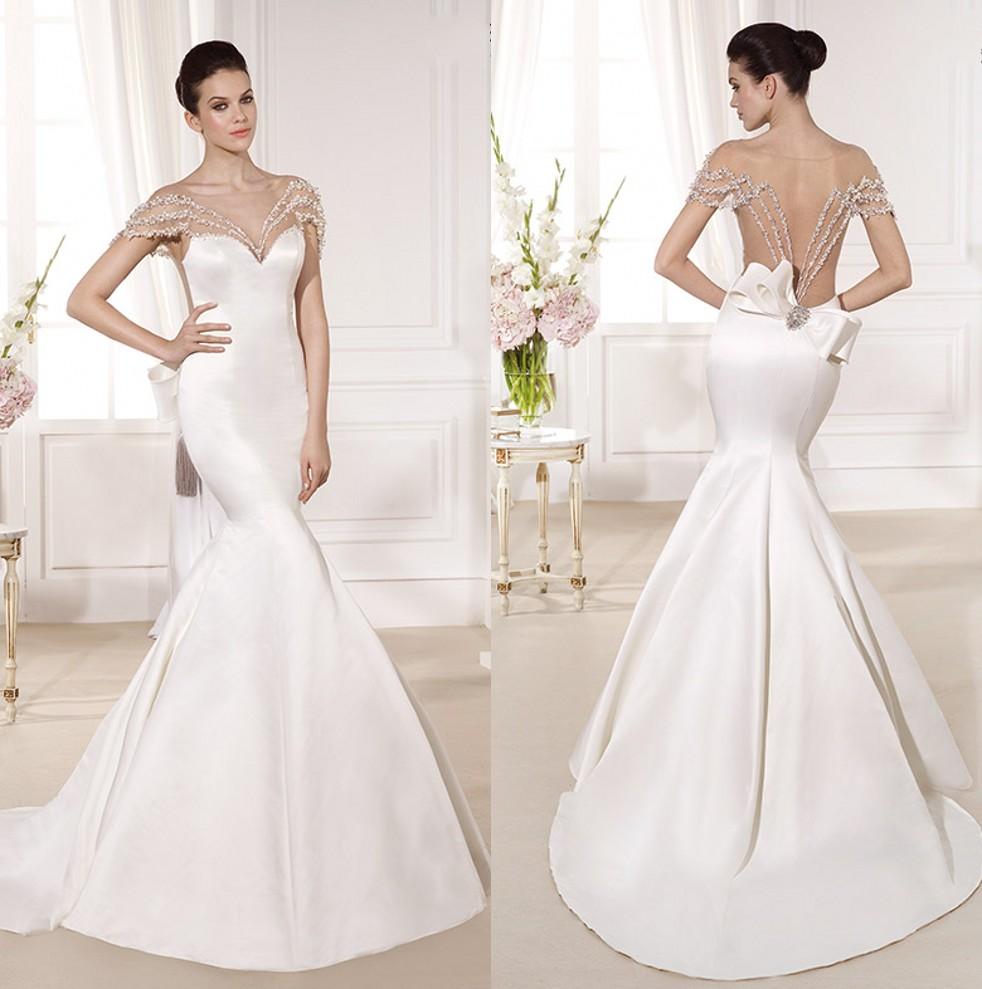 satin mermaid wedding gown with embelishment and open back