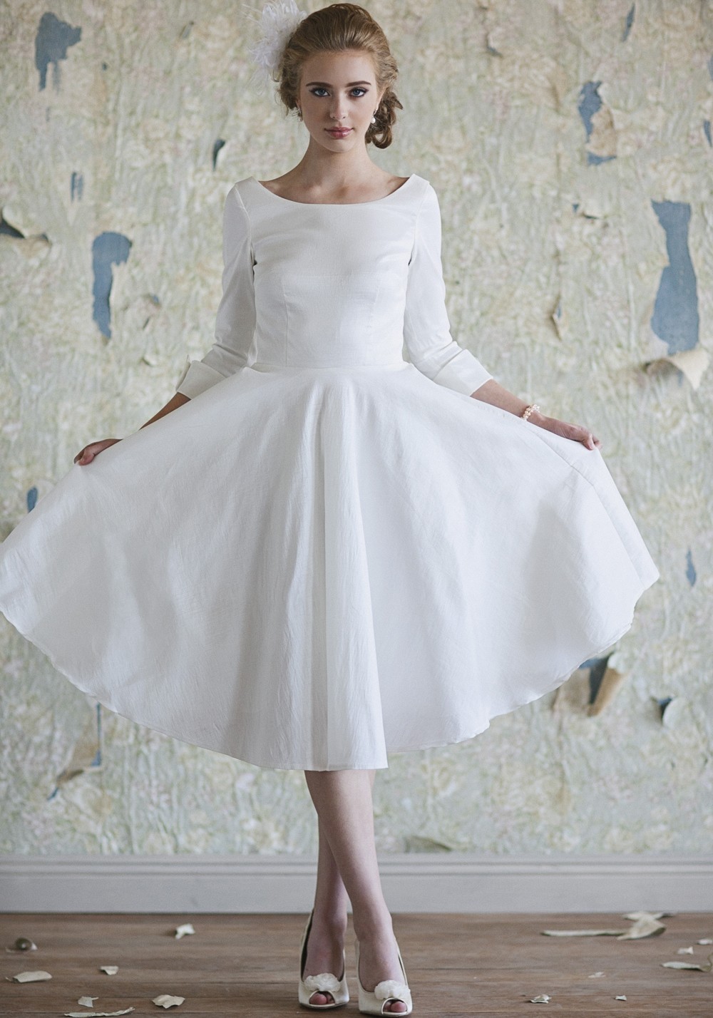 white tea length dress with sleeves