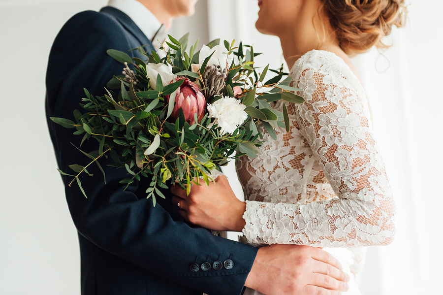 Bride in long sleeved wedding dress