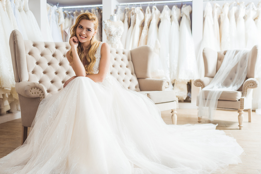 Young bride in tulle dress in wedding salon