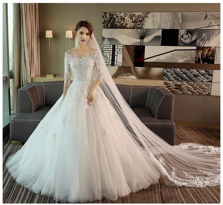 A-line wedding dress with illusion bodice and sleeves