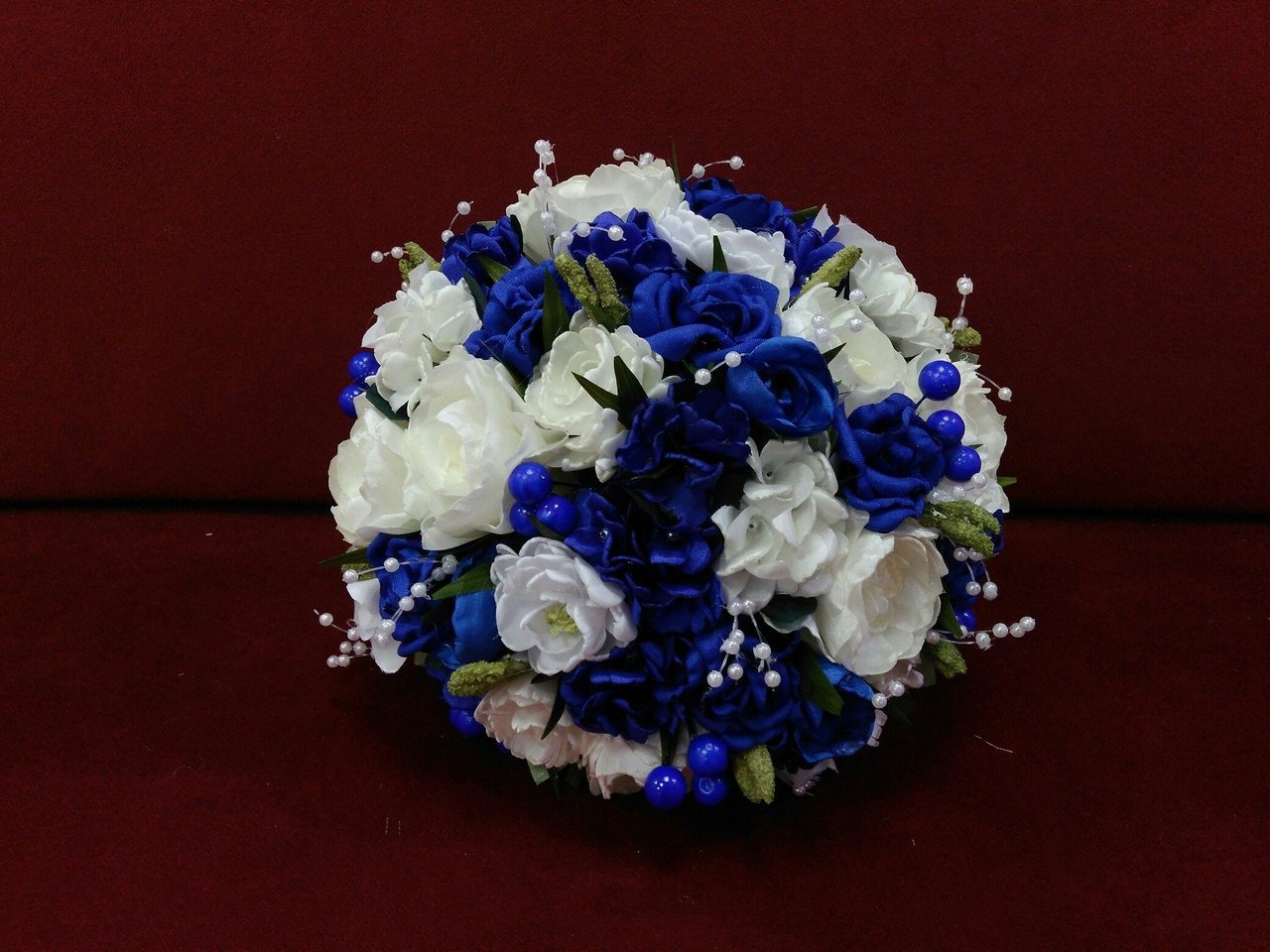 Blue bridal bouquet of artificial flowers